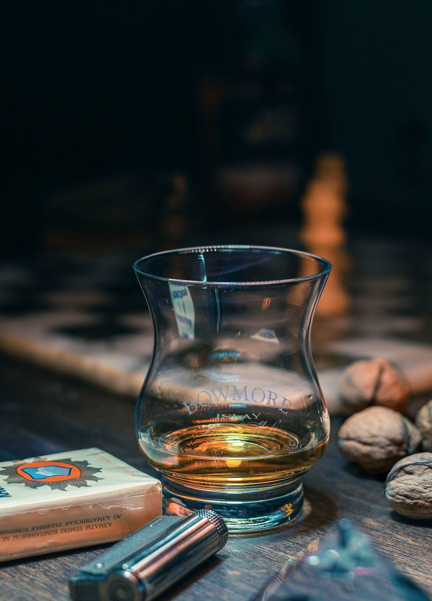 clear shot glass on brown wooden table