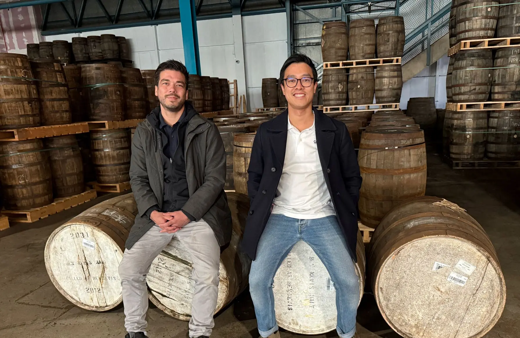 Spirited owners Dan and Mat atop of their whisky casks